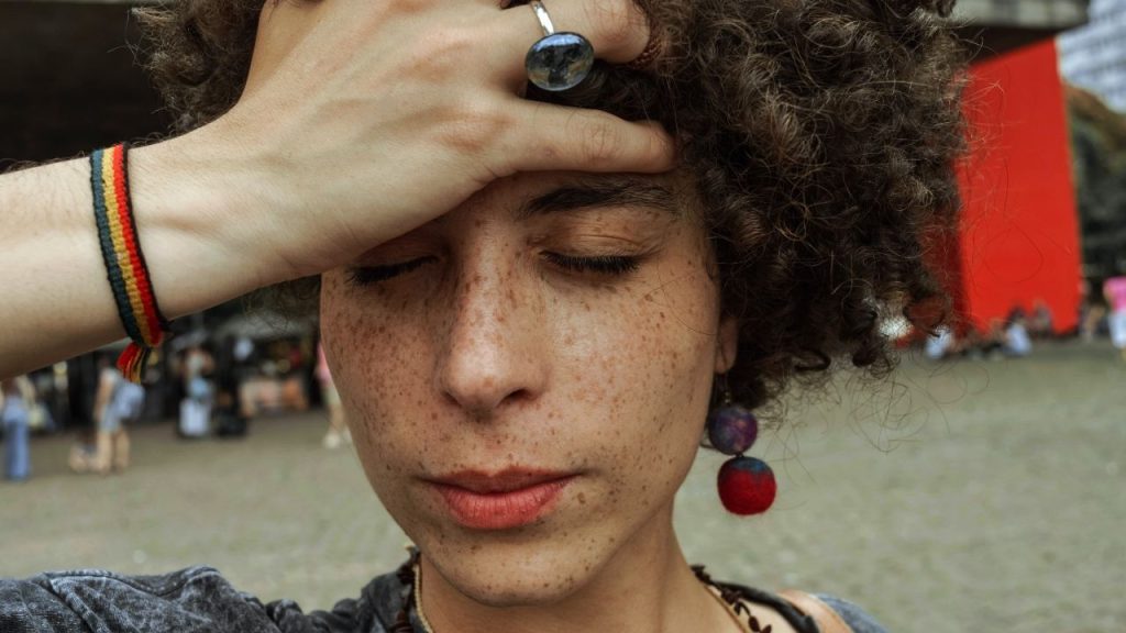 young woman looking stressed out